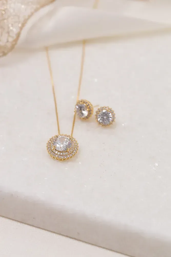 CONJUNTO REDONDO CRAVEJADO COM ZIRCÔNIAS CRISTAIS BANHO OURO 18K
