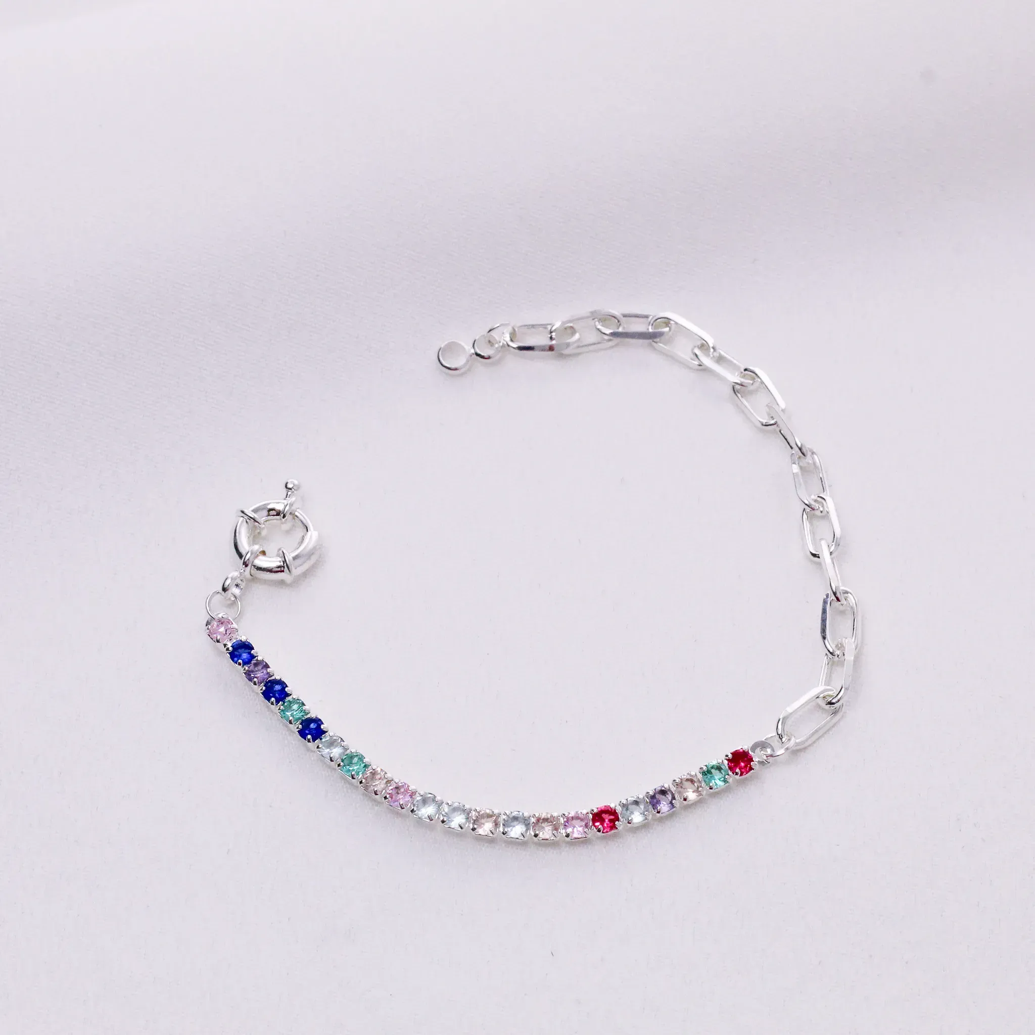 PULSEIRA ELOS COM ZIRCÔNIAS COLORIDAS E FECHO BOIA BANHO PRATA