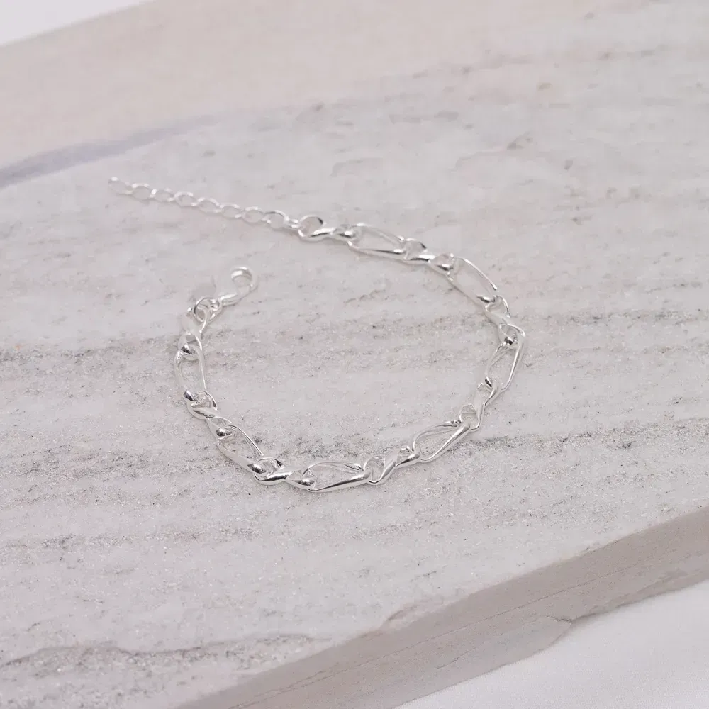 PULSEIRA ELOS TORCIDOS BANHO PRATA