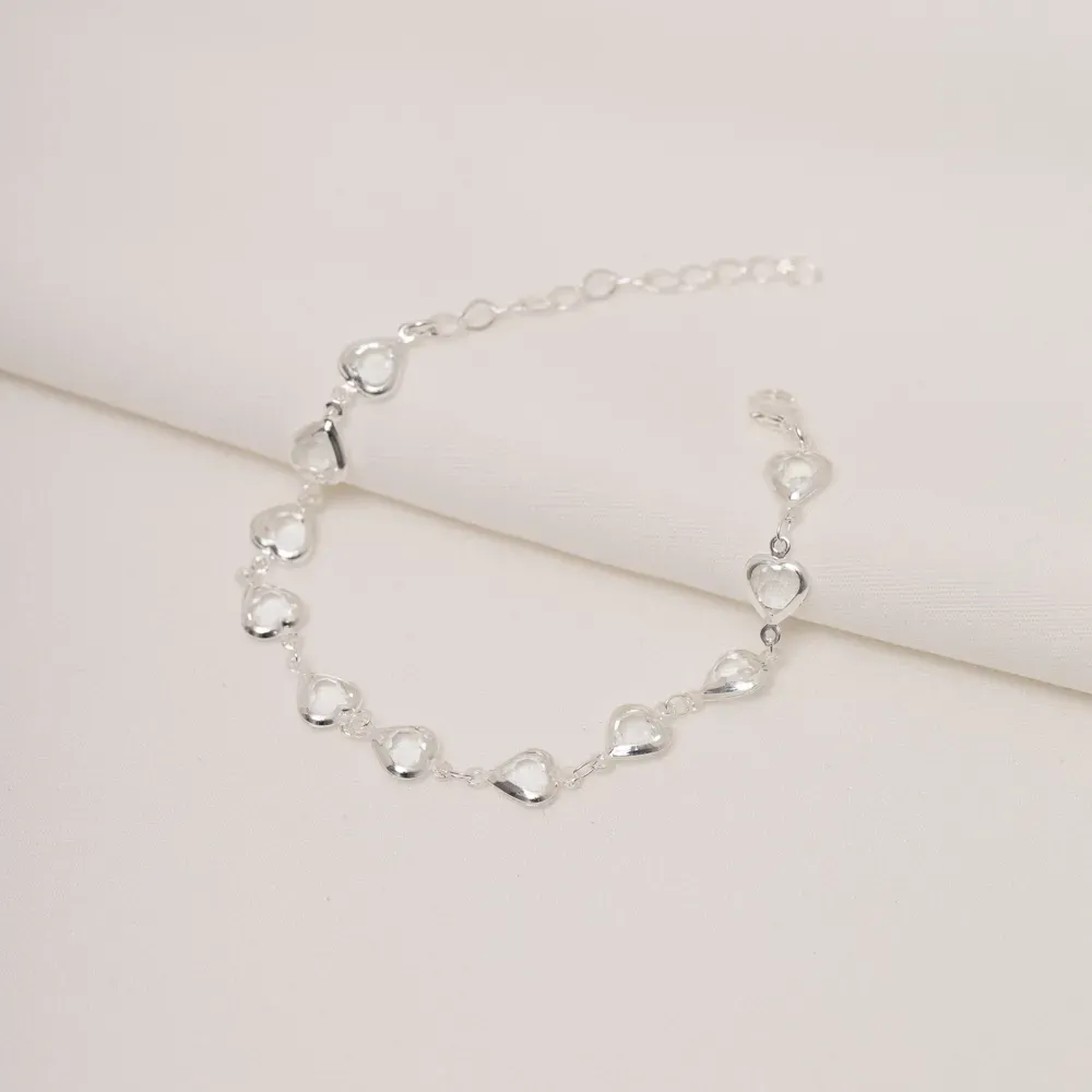 PULSEIRA ZIRCÔNIA COM CORAÇÕES VAZADOS BANHO PRATA