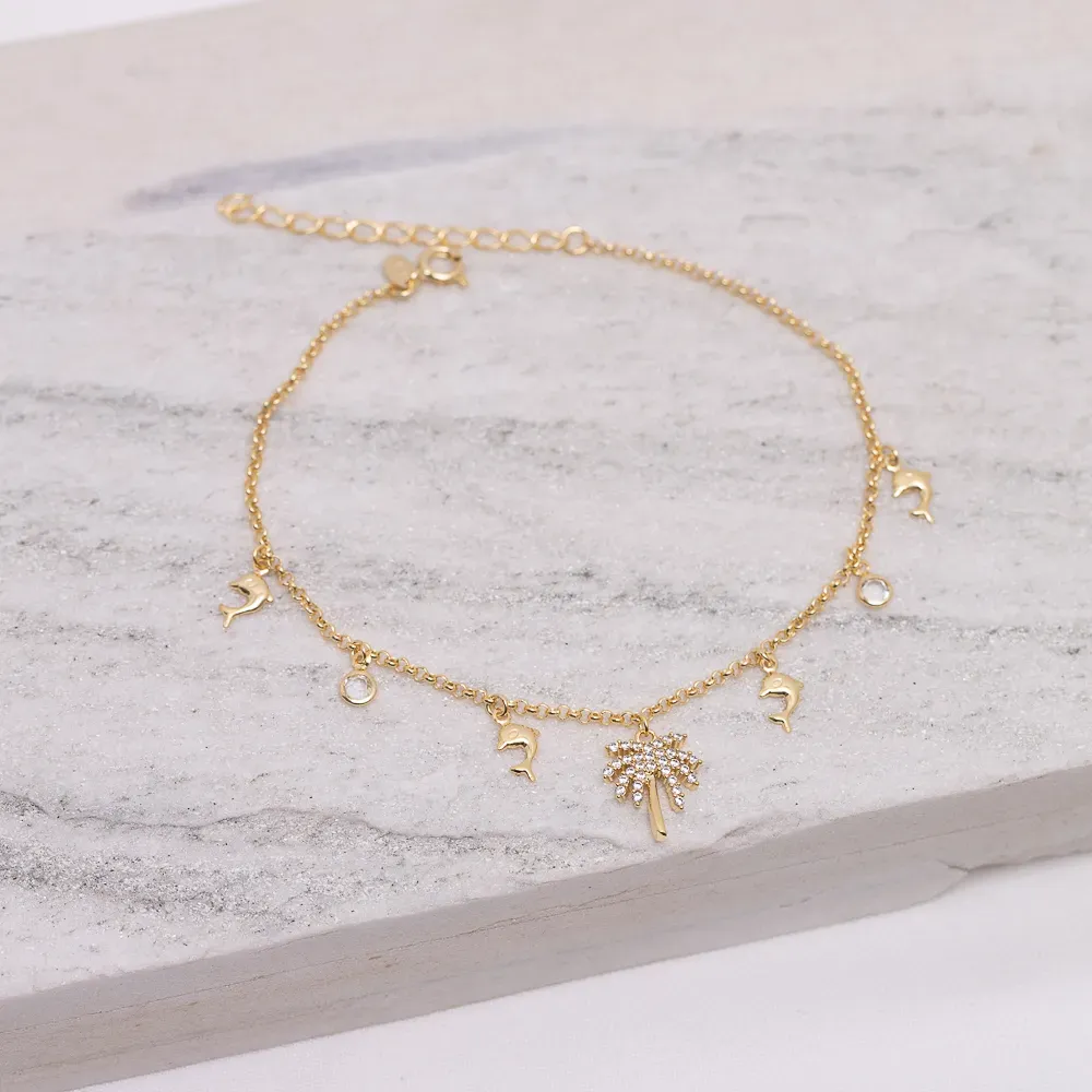 TORNOZELEIRA GOLFINHO, COQUEIRO E CRISTAL BANHO OURO 18K