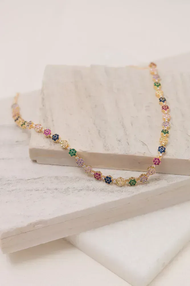COLAR RIVIERA FLOR COM ZIRCÔNIAS COLORIDAS CLARAS BANHO OURO 18K