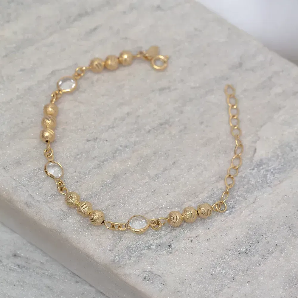 PULSEIRA INFANTIL COM ZIRCÔNIAS E BOLINHAS FOSCAS BANHO OURO 18K