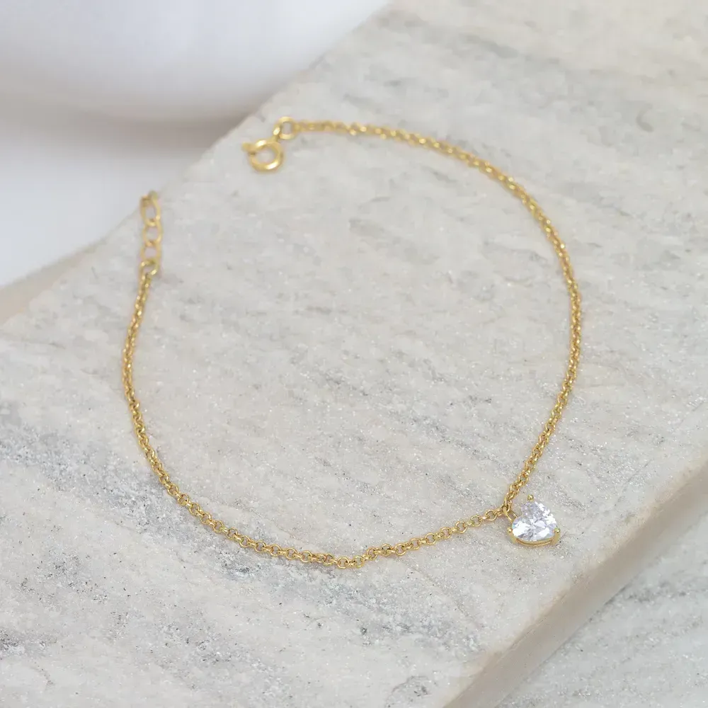 TORNOZELEIRA COM PONTO DE LUZ CORAÇÃO CRISTAL BANHO OURO 18K