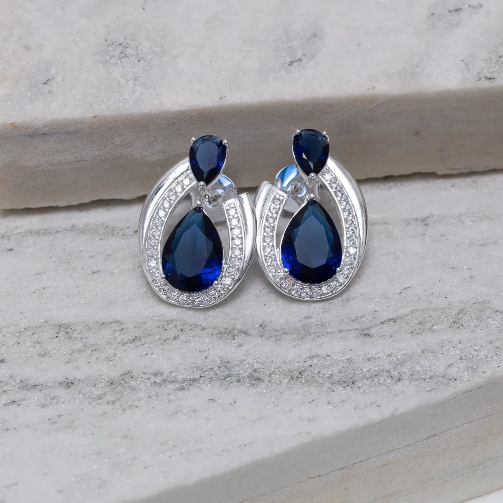 BRINCO FESTA COM ZIRCÔNIA E PEDRA AZUL BANHO PRATA