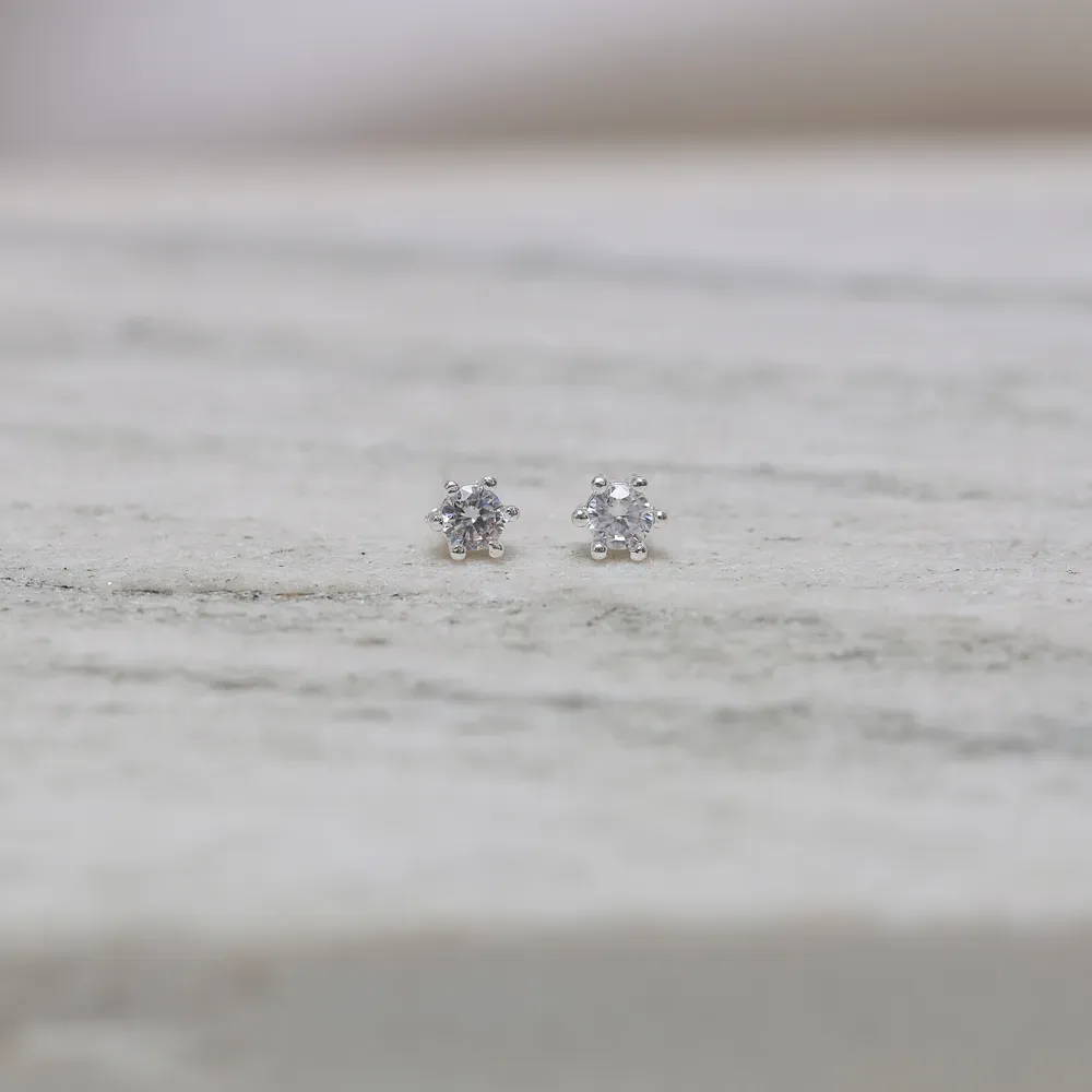 BRINCO PONTO DE LUZ 6 GARRAS BANHO PRATA