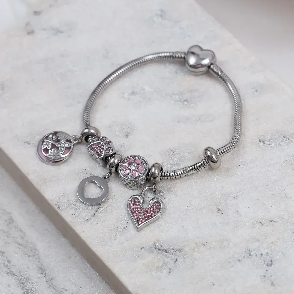 PULSEIRA 6 BERLOQUES COM ZIRCÔNIAS ROSA AÇO INOX