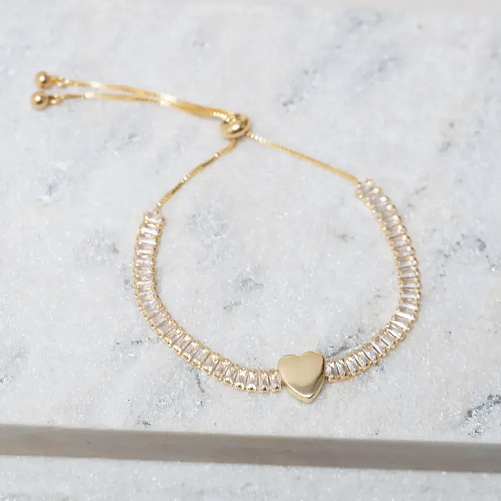 PULSEIRA RIVIERA CRISTAL REGULÁVEL COM CORAÇÃO BANHO OURO 18K
