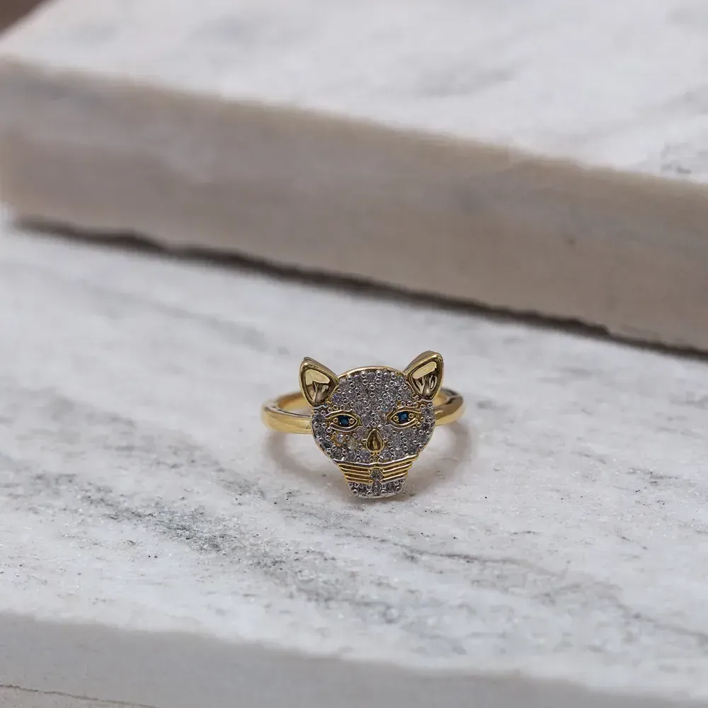 ANEL TIGRE CRAVEJADO COM OLHO AZUL BANHO OURO 18K
