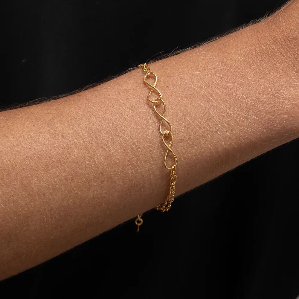 PULSEIRA TRÊS INFINITOS BANHO OURO 18K