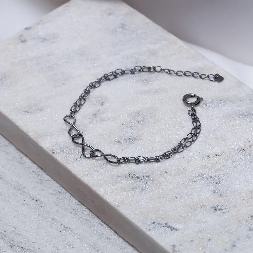 PULSEIRA TRÊS INFINITOS BANHO RÓDIO NEGRO