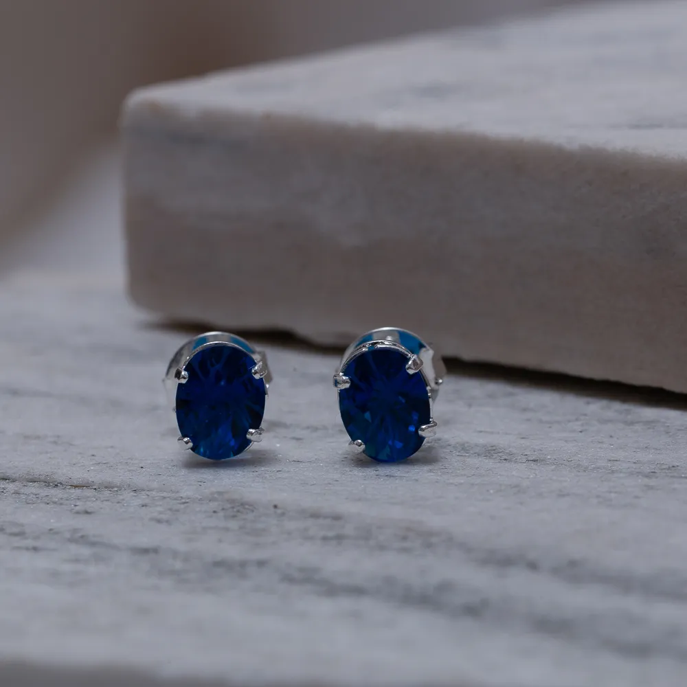 BRINCO PONTO DE LUZ OVAL AZUL BANHO PRATA
