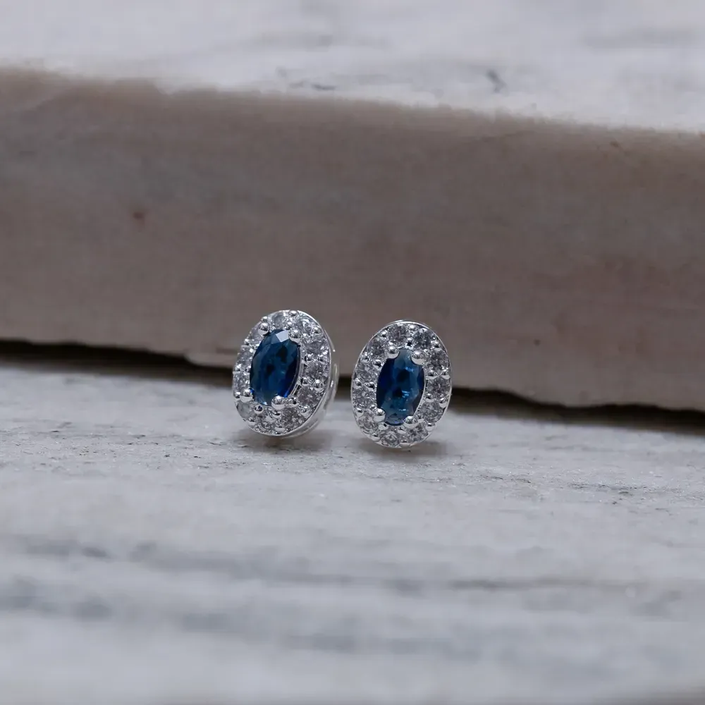 BRINCO PONTO LUZ OVAL PEDRA AZUL BANHO PRATA