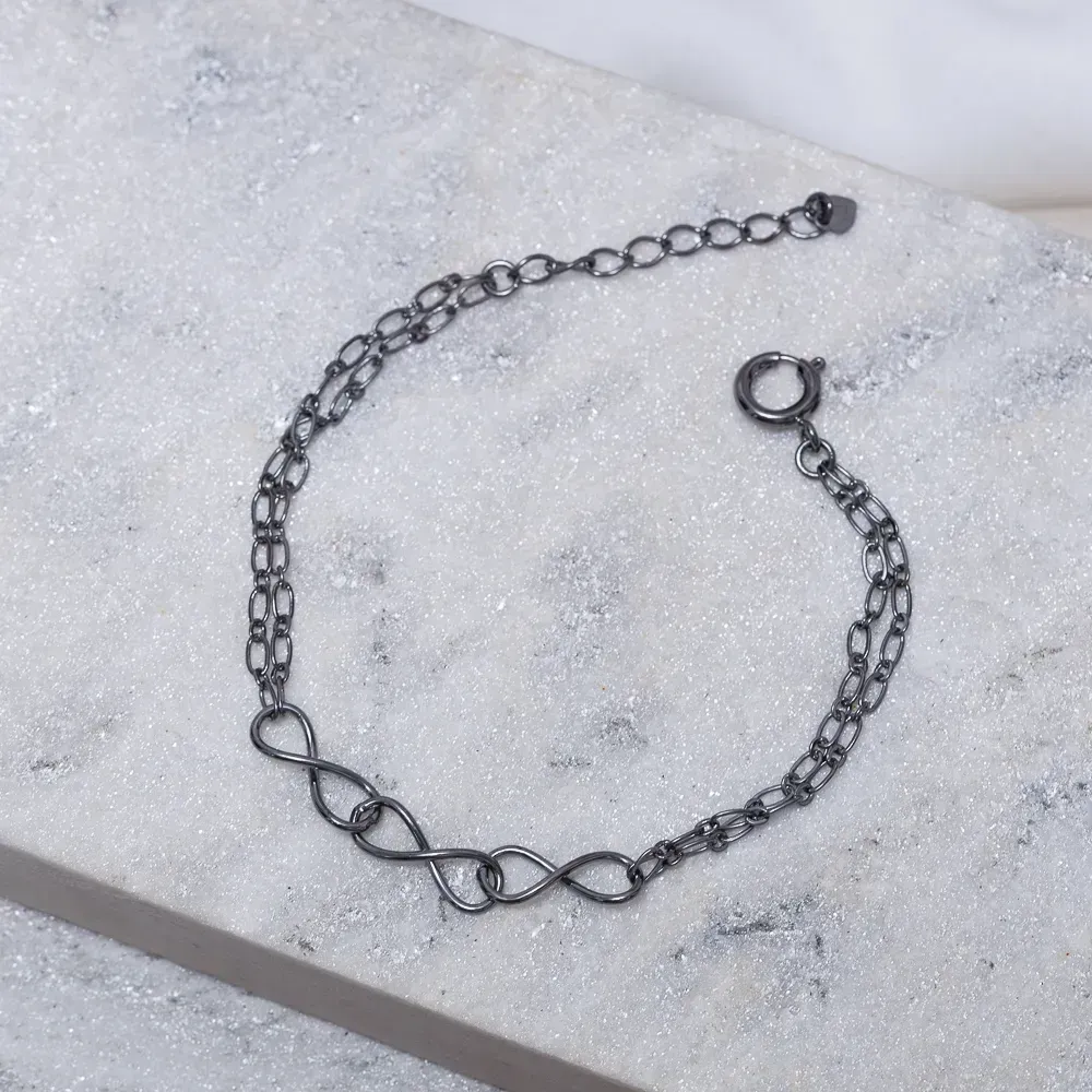PULSEIRA TRÊS INFINITOS BANHO RÓDIO NEGRO