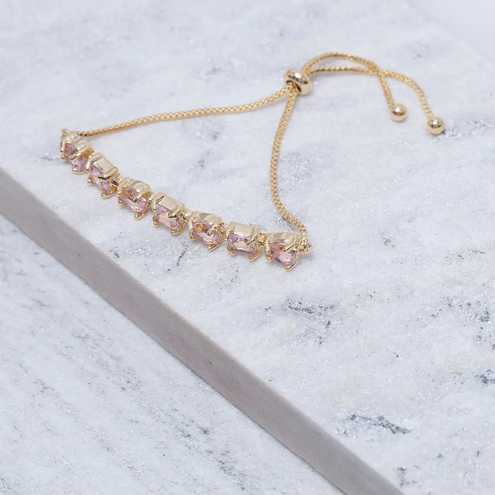 PULSEIRA CORAÇÃO COM PEDRAS ROSA CLARO FECHO GRAVATINHA BANHO OURO 18K