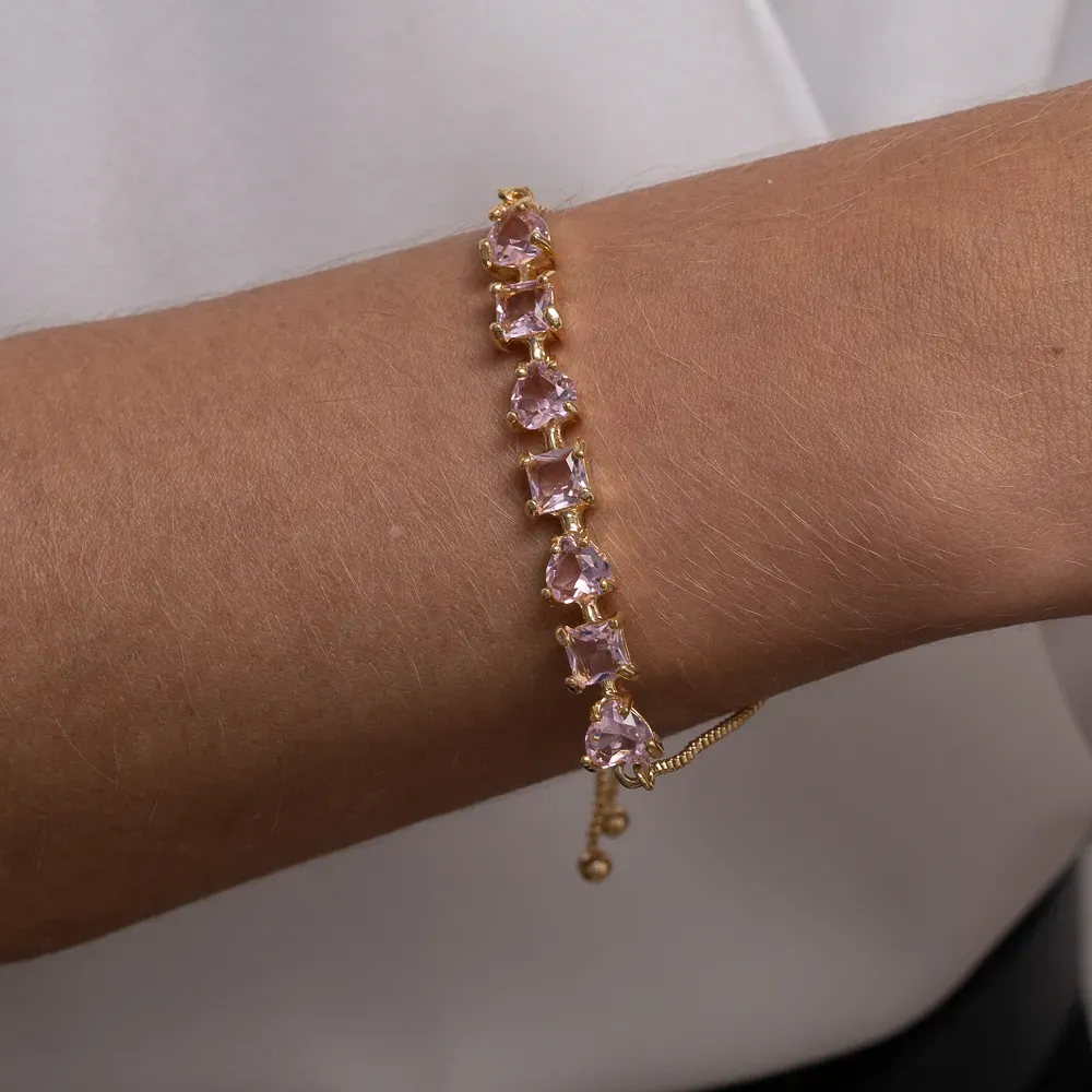 PULSEIRA CORAÇÃO COM PEDRAS ROSA CLARO FECHO GRAVATINHA BANHO OURO 18K
