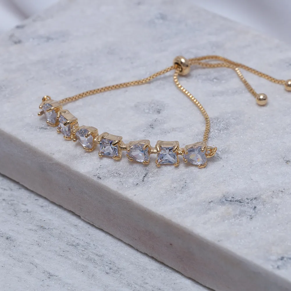 PULSEIRA CORAÇÃO COM PEDRAS CRISTAL FECHO GRAVATINHA BANHO OURO 18K
