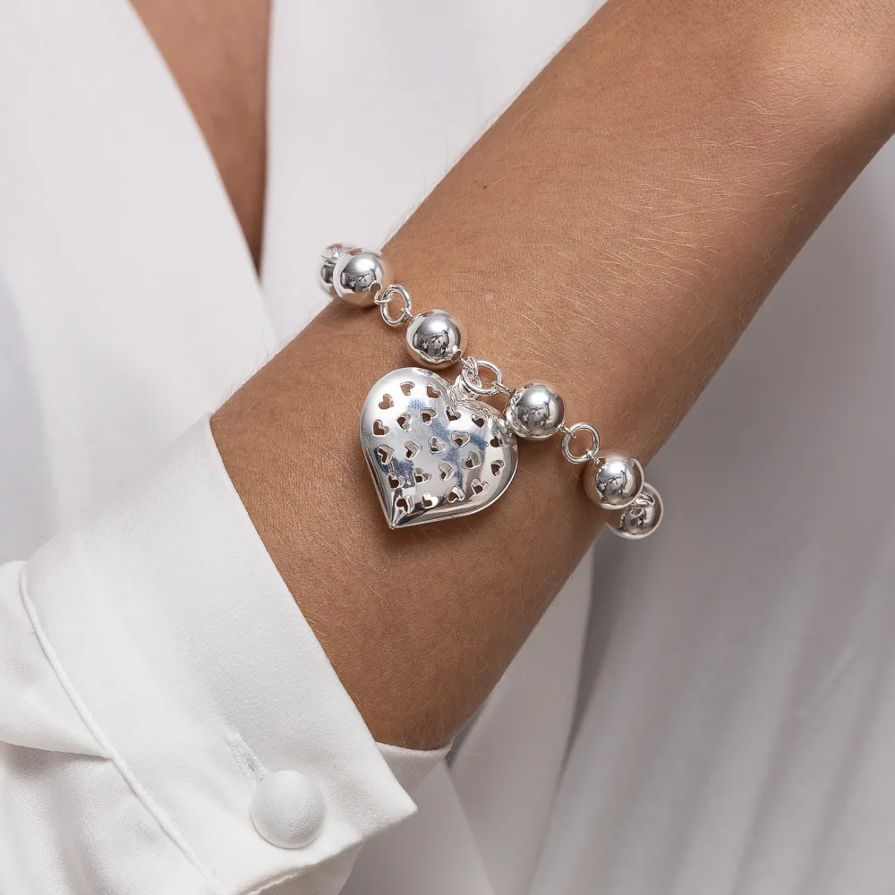 PULSEIRA BOLINHAS G COM PINGENTE CORAÇÃO BANHO PRATA