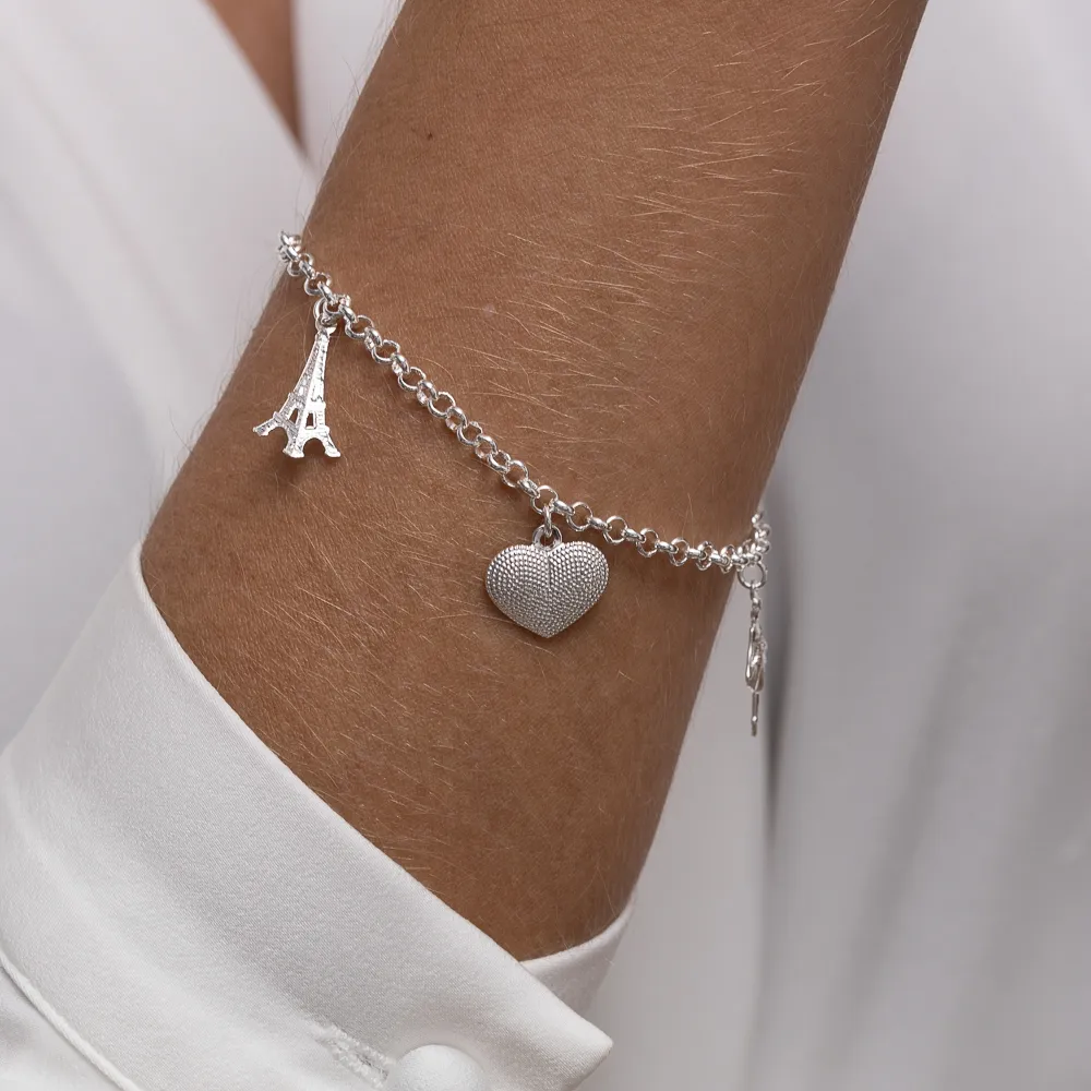 PULSEIRA COM PINGENTE TORRE EIFFELL, CORAÇÃO E BAILARINA BANHO PRATA