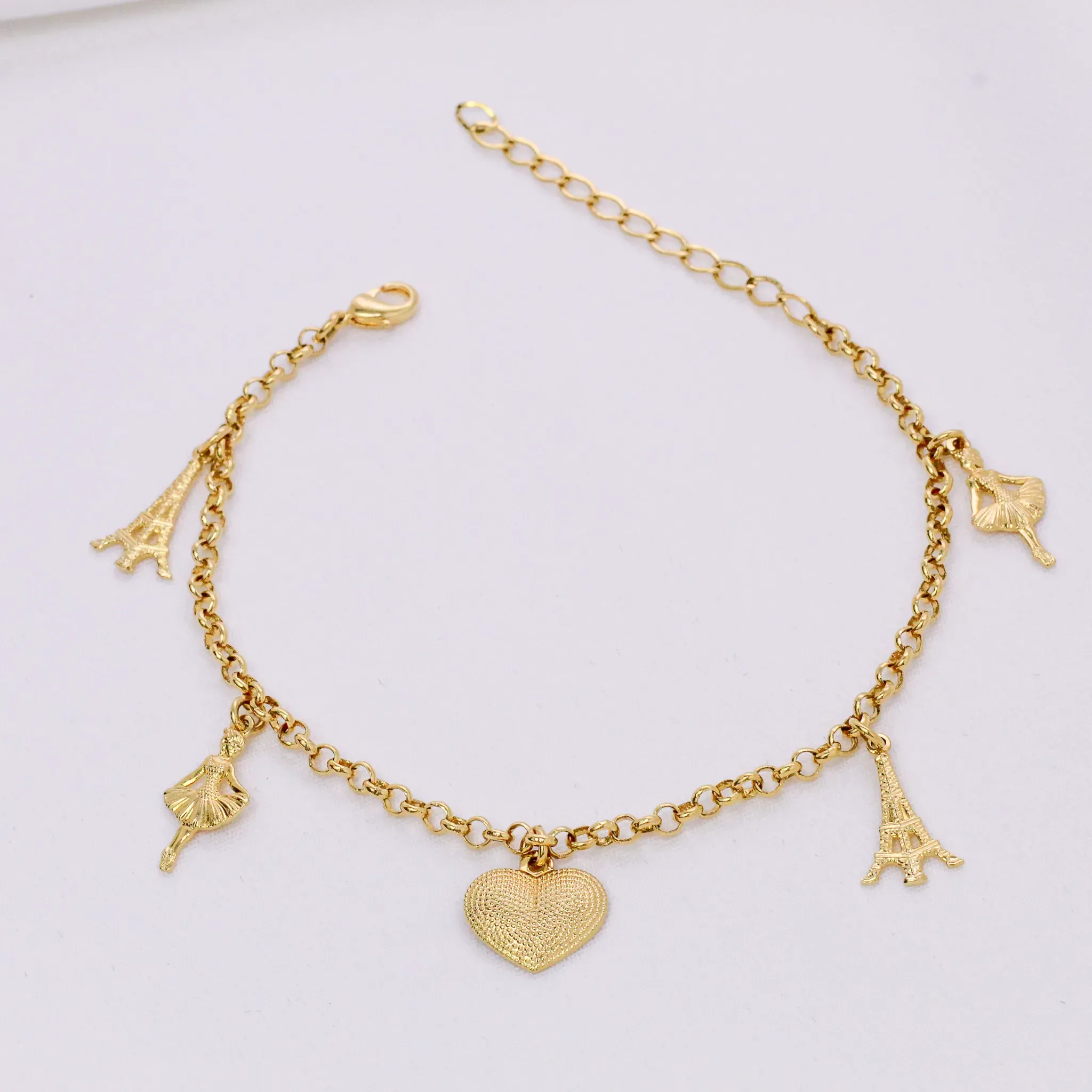 PULSEIRA COM PINGENTE TORRE EIFFELL, CORAÇÃO E BAILARINA BANHO OURO 18K