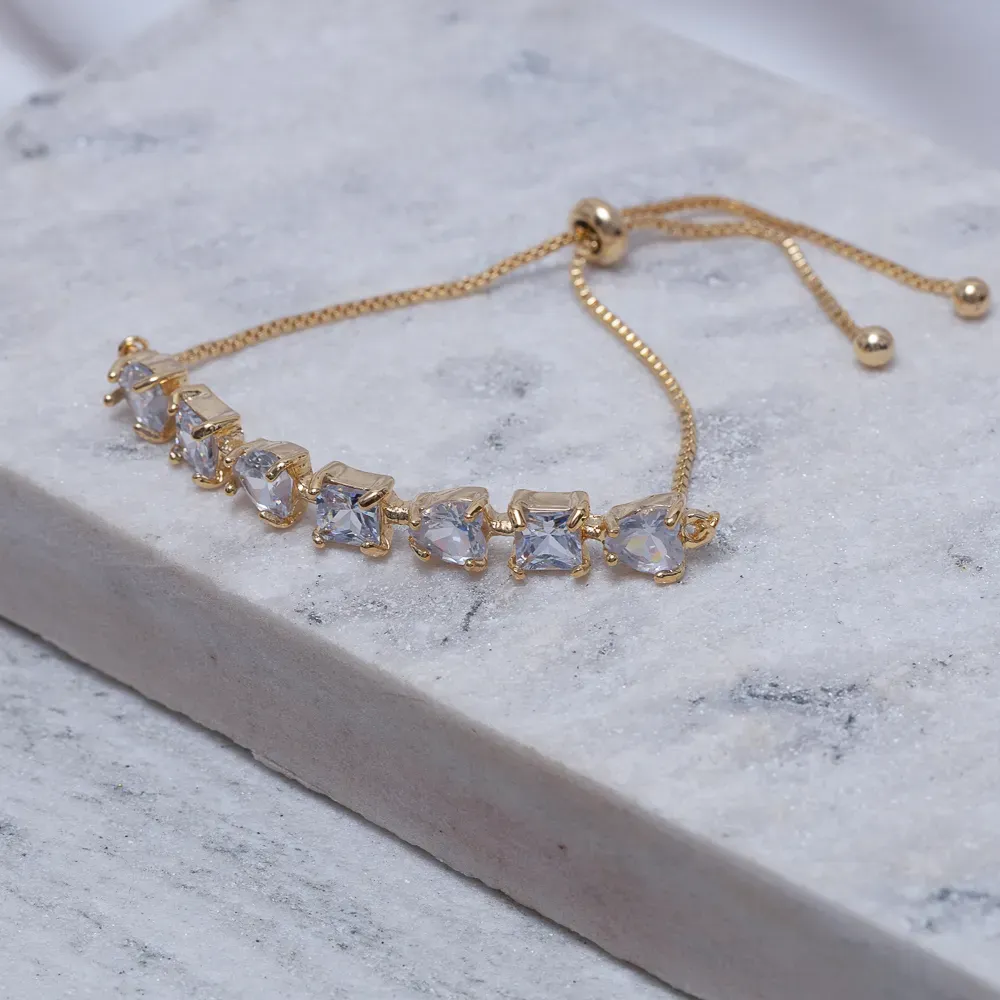 PULSEIRA CORAÇÃO COM PEDRAS CRISTAL FECHO GRAVATINHA BANHO OURO 18K