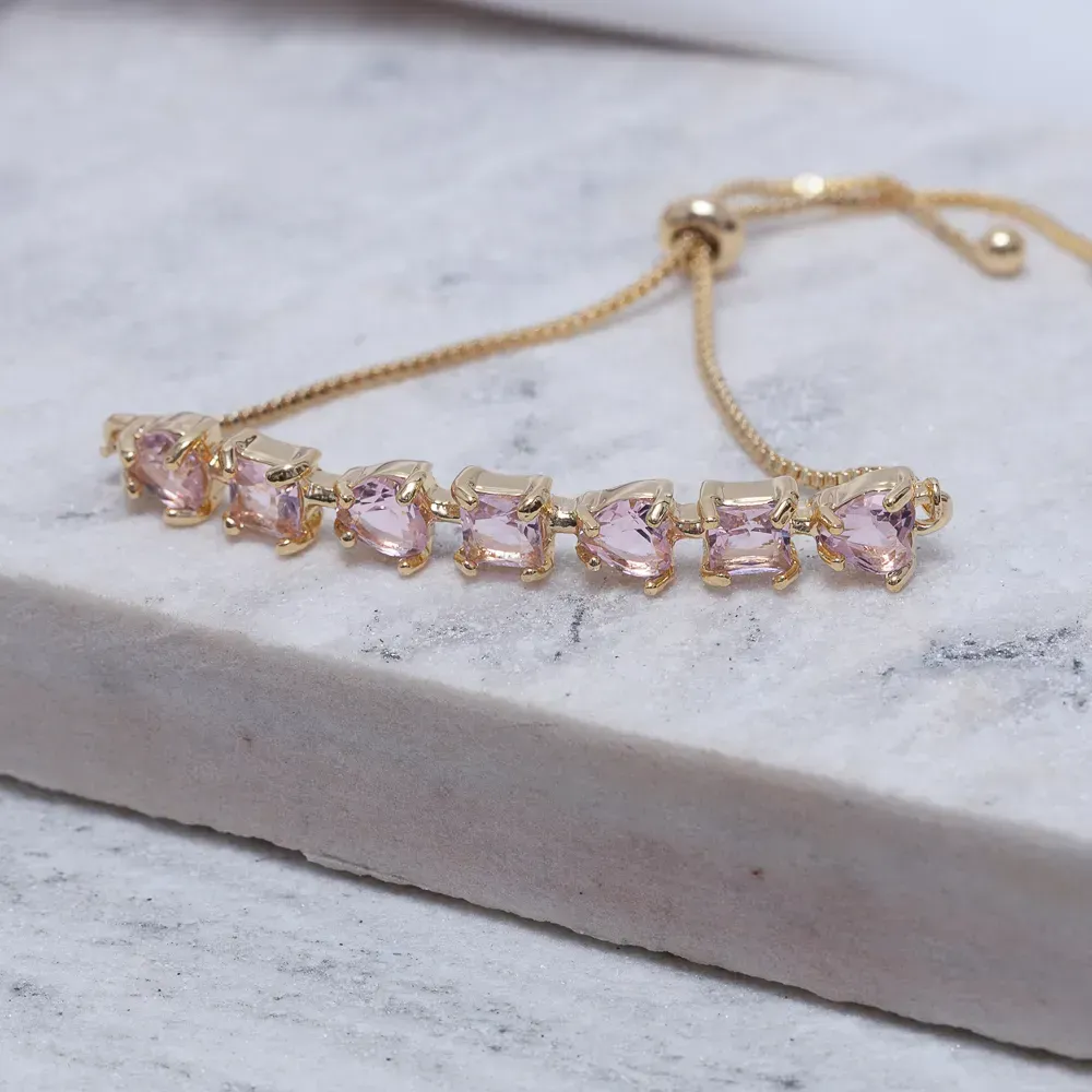 PULSEIRA CORAÇÃO COM PEDRAS ROSA CLARO FECHO GRAVATINHA BANHO OURO 18K