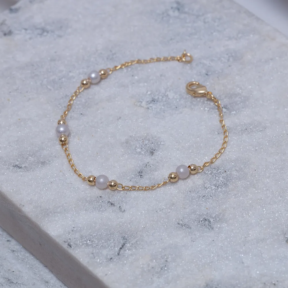 PULSEIRA BOLINHA E PÉROLA P BANHO OURO 18K