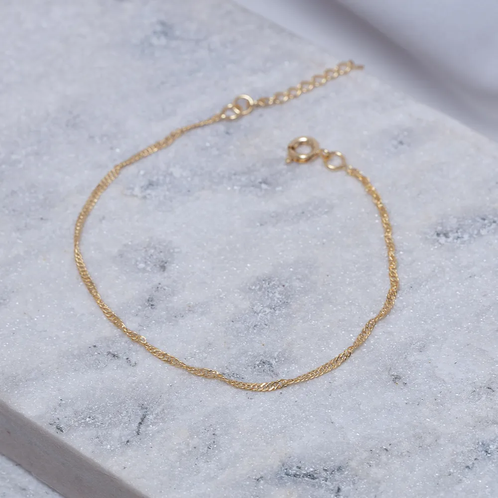 PULSEIRA TORCIDA FINA BANHO OURO 18K