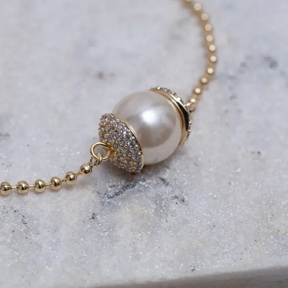 PULSEIRA PÉROLA COM ZIRCÔNIAS BANHO OURO 18K