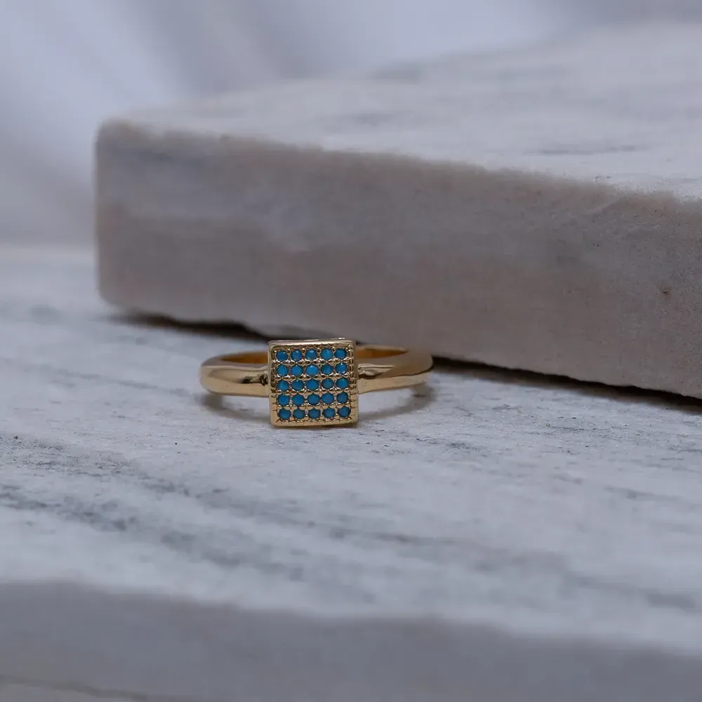 ANEL QUADRADO AZUL CLARO BANHO OURO 18K