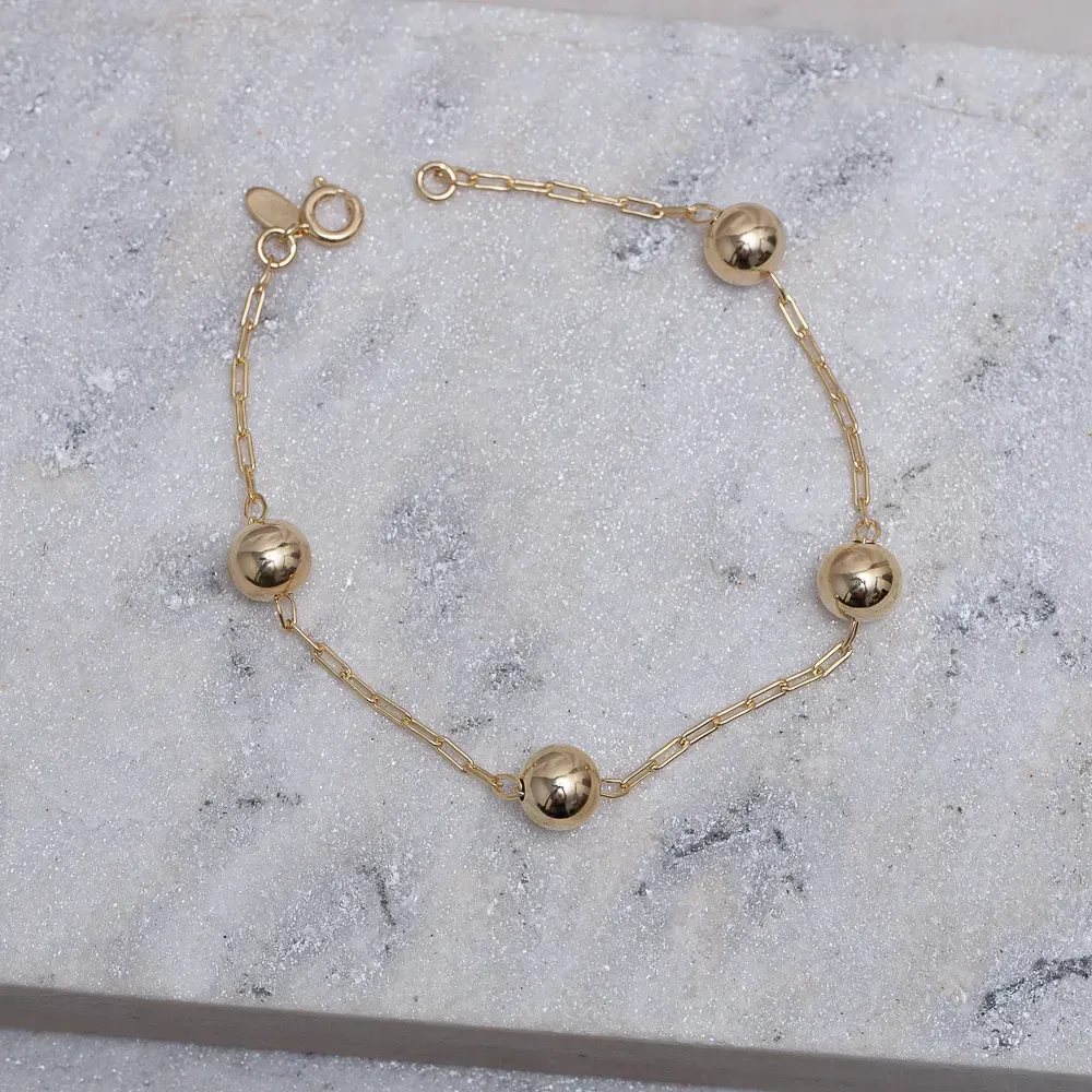 PULSEIRA BOLINHAS M LISAS BANHO OURO 18K