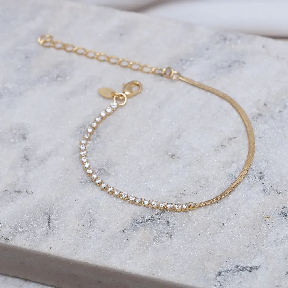 PULSEIRA FITA ESPELHADA E COM ZIRCÔNIAS BANHO OURO 18K