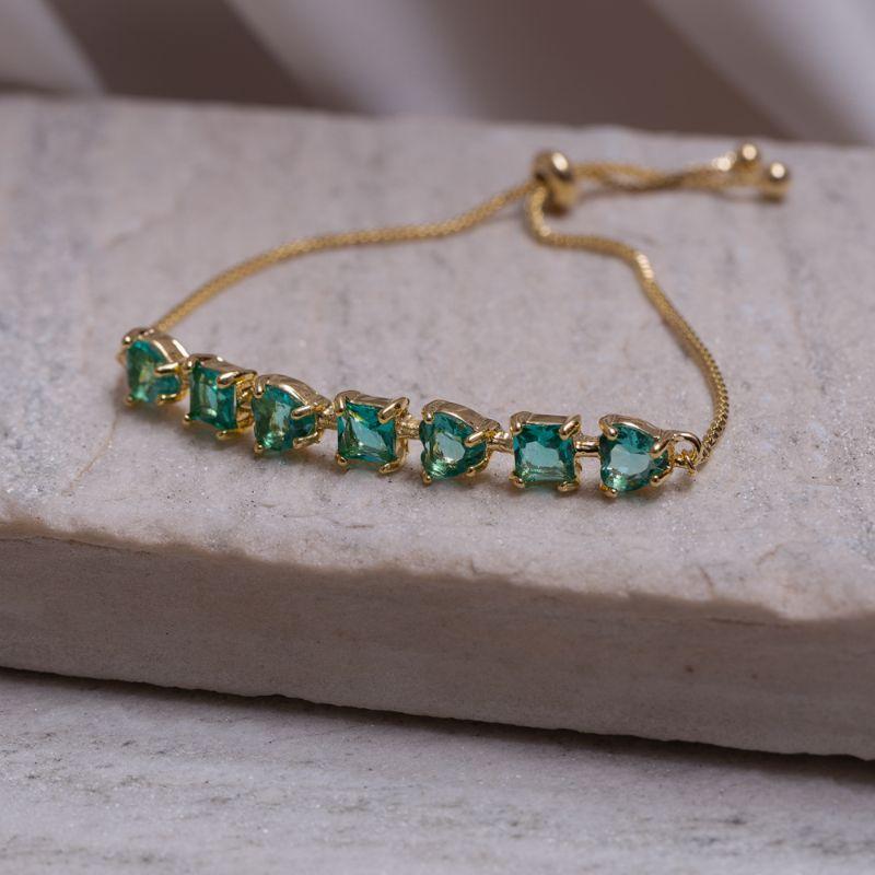 PULSEIRA CORAÇÃO COM PEDRAS VERDES FECHO GRAVATINHA BANHO OURO 18K