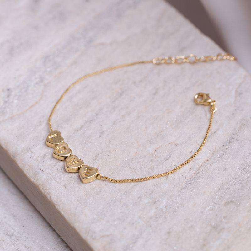 PULSEIRA CORAÇÕES E LOVE BANHO OURO 18K