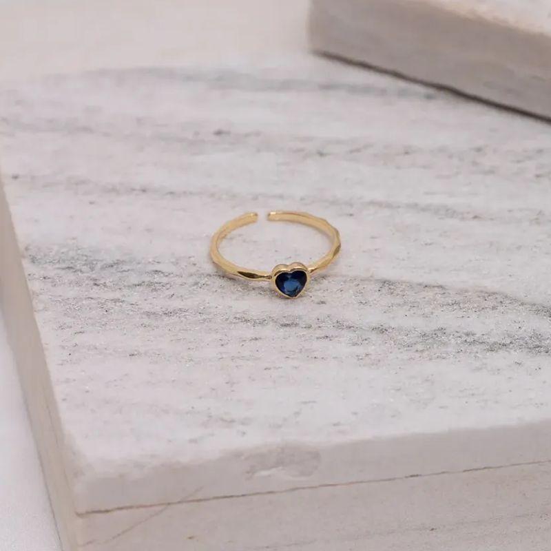 ANEL REGULÁVEL CORAÇÃO COM PEDRA AZUL BANHO OURO 18K