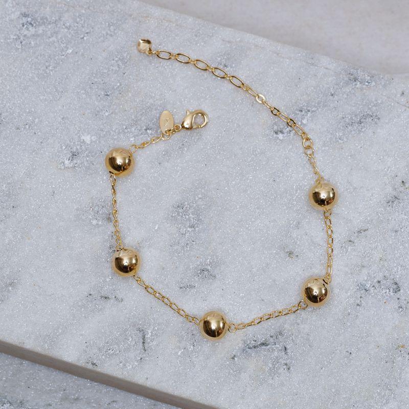 PULSEIRA BOLA LISA M BANHO OURO 18K
