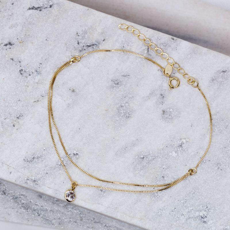 TORNOZELEIRA DUPLA COM CRISTAL BANHO OURO 18K