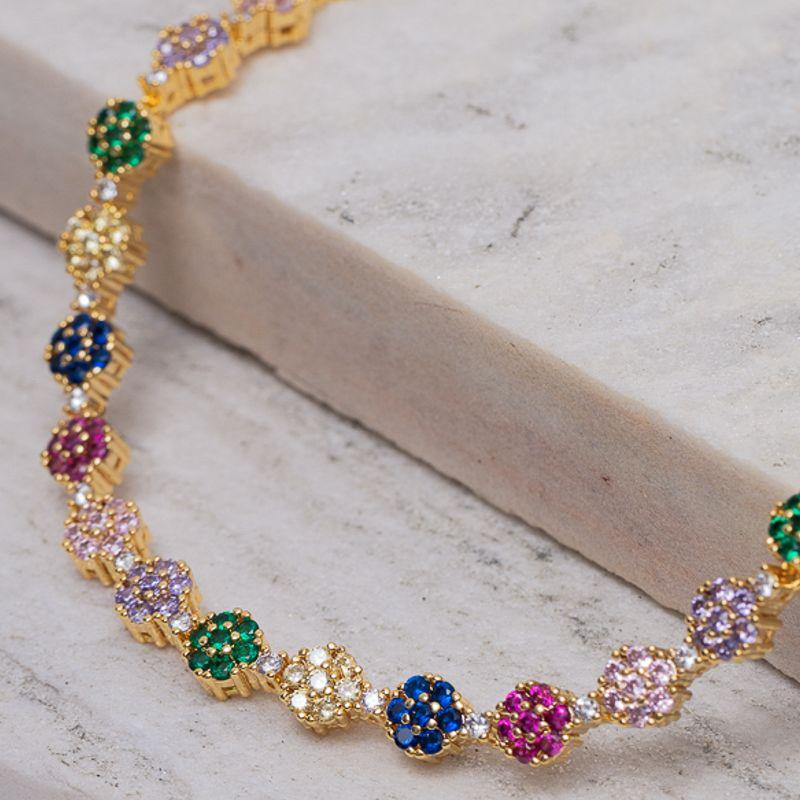 COLAR RIVIERA FLOR CRAVEJADO COM ZIRCÔNIAS COLORIDAS BANHO OURO 18K