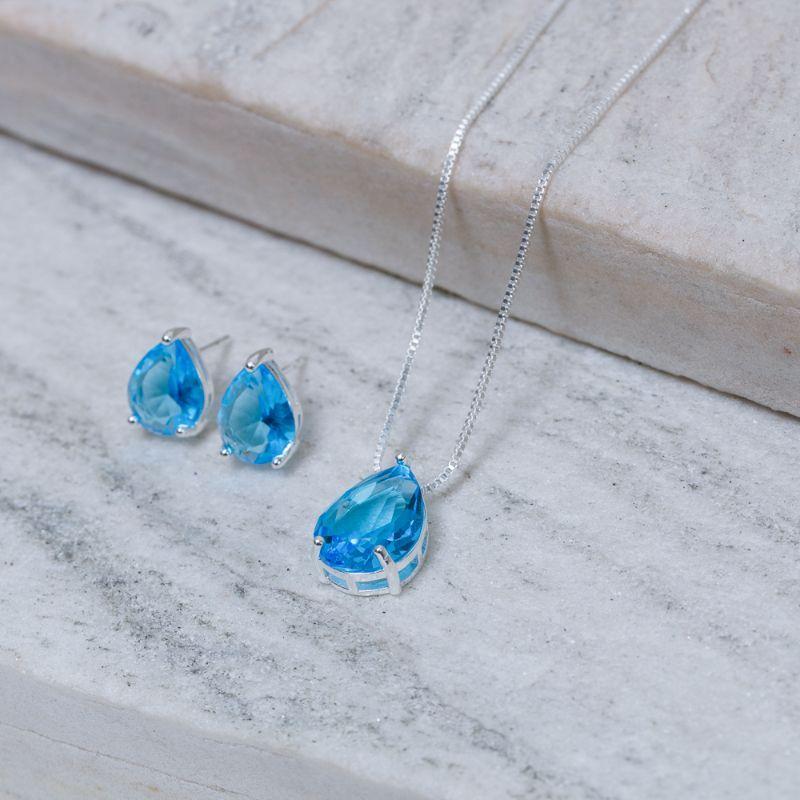 CONJUNTO GOTA COM PEDRA AZUL CLARO BANHO PRATA