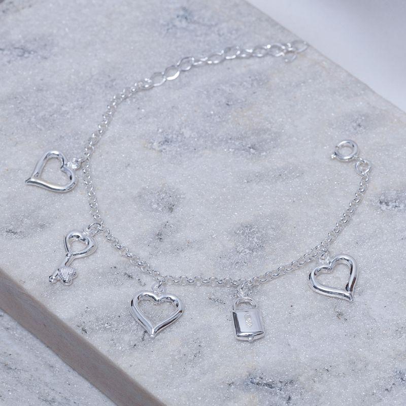 PULSEIRA COM PINGENTE CORAÇÃO CHAVE CADEADO BANHO PRATA