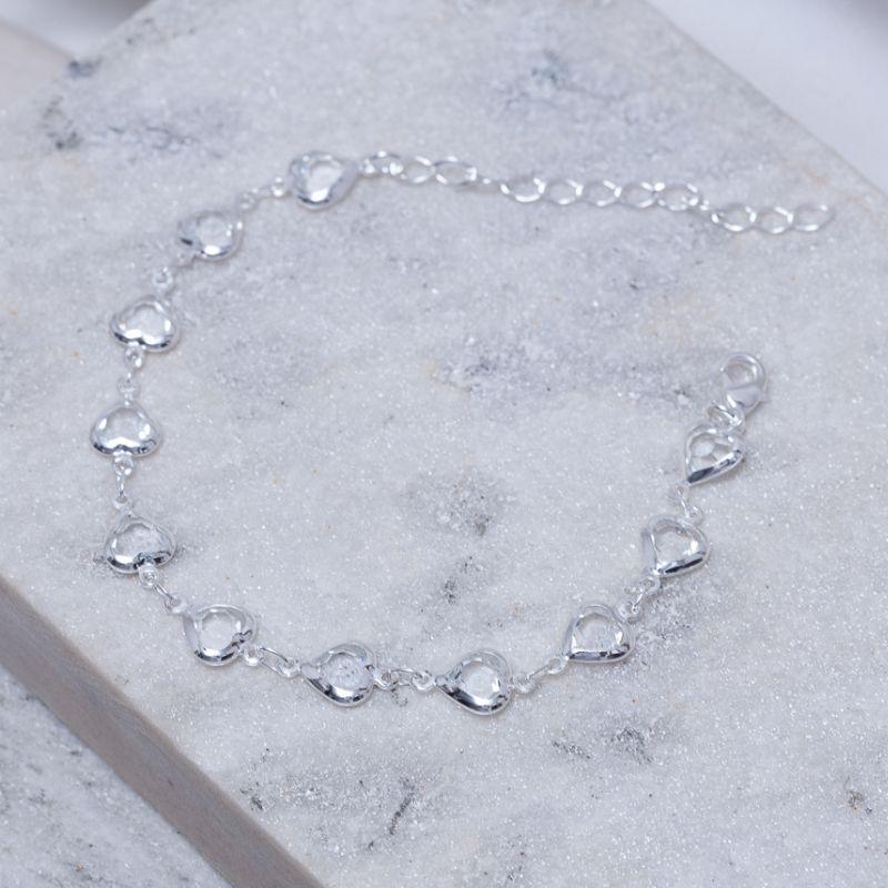 PULSEIRA ZIRCÔNIA COM CORAÇÕES VAZADOS BANHO PRATA