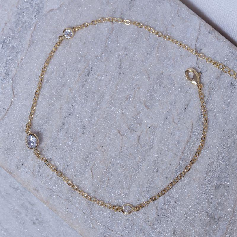 TORNOZELEIRA 3 PONTOS DE LUZ BANHO OURO 18K