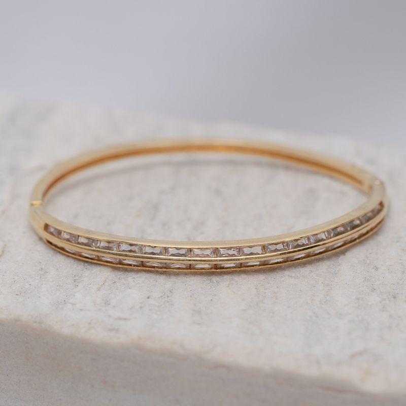 BRACELETE ABAULADO CRAVEJADO COM ZIRCÔNIAS CRISTAIS BANHO OURO 18K