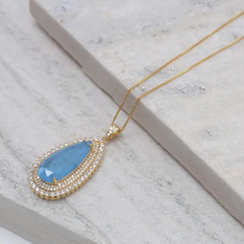 COLAR GOTA COM ZIRCÔNIAS E PEDRA AZUL CLARO G BANHO OURO 18K