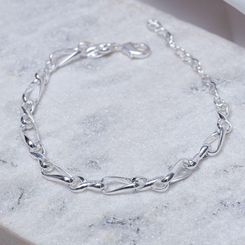 PULSEIRA ELOS TORCIDOS BANHO PRATA