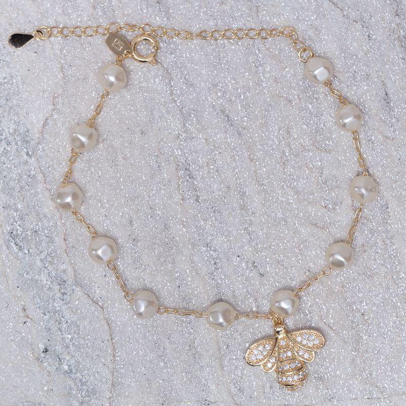 PULSEIRA PÉROLA COM LIBÉLULA CRAVEJADA BANHO OURO 18K