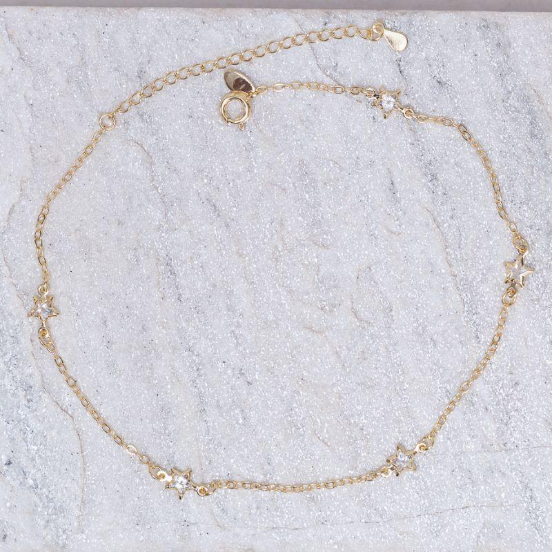 TORNOZELEIRA ESTRELINHAS CRISTAIS BANHO OURO 18K
