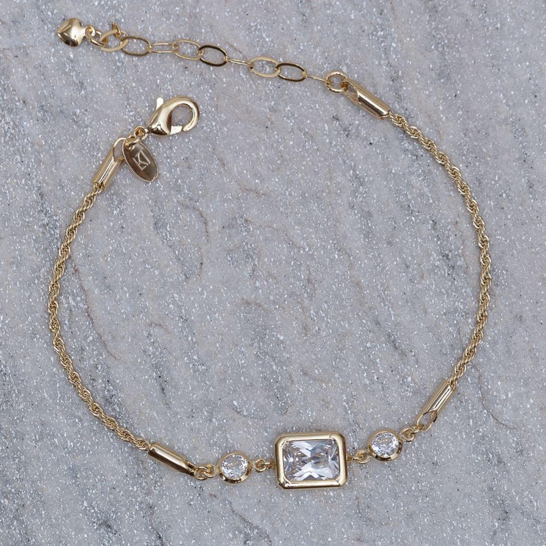 PULSEIRA CABO DE AÇO PP E PEDRA CRISTAL BANHO 18K
