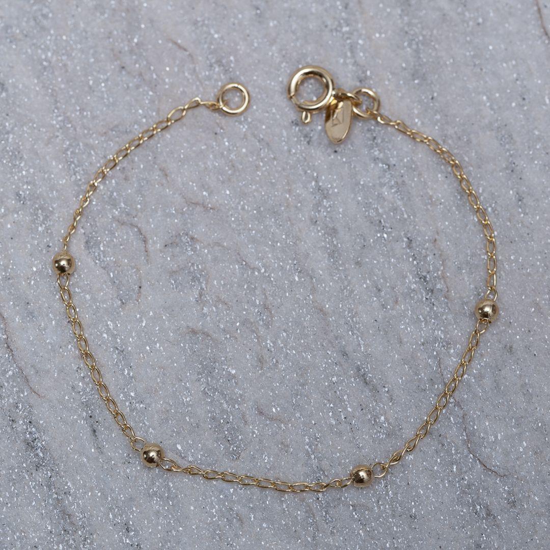 PULSEIRA INFANTIL BOLINHAS BANHO OURO 18K