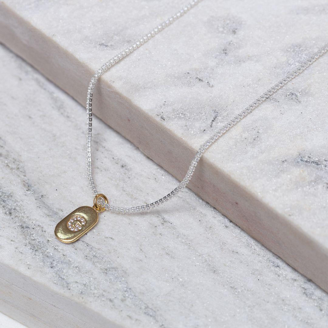 CHOKER RIVIERA PP COM LETRA G CRISTAL BANHO PRATA